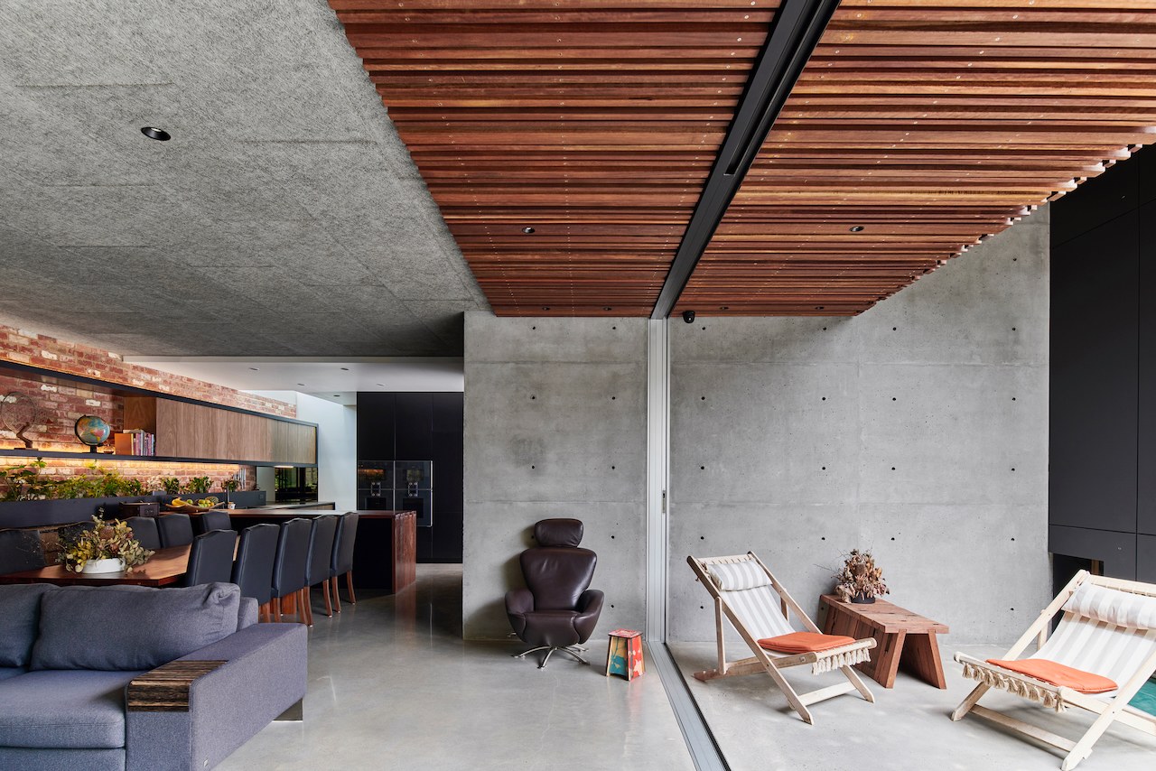 Lanes End living area with recliners beneath the concrete soffit