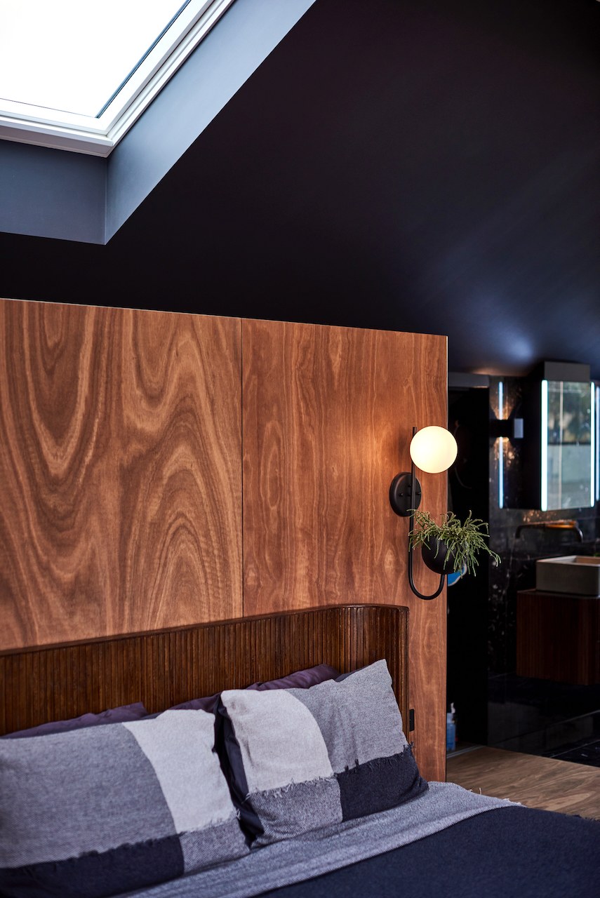 Lanes End bedroom light detail — wall sconce and hanging plant