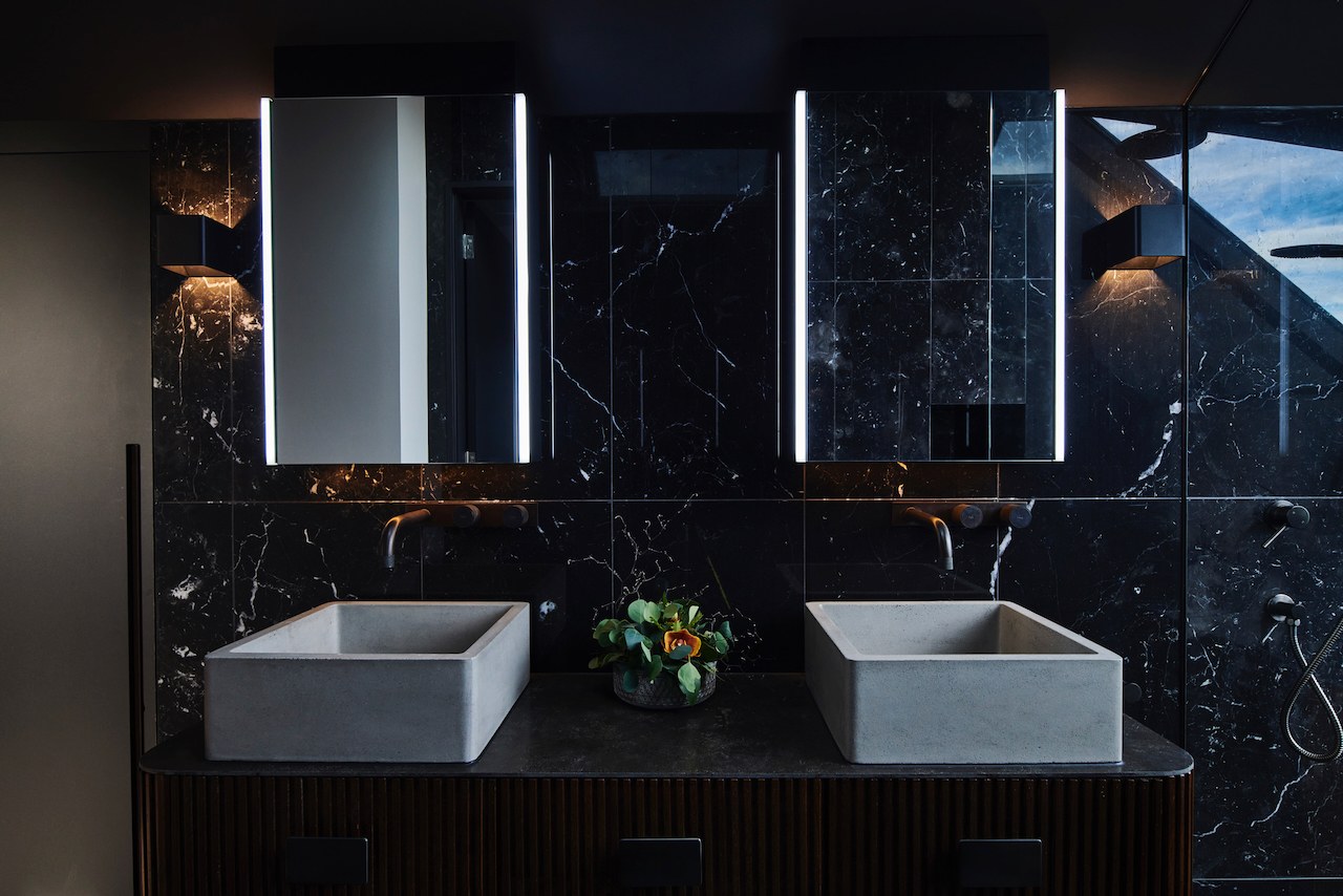 Lanes End ensuite with twin concrete basins and black marble