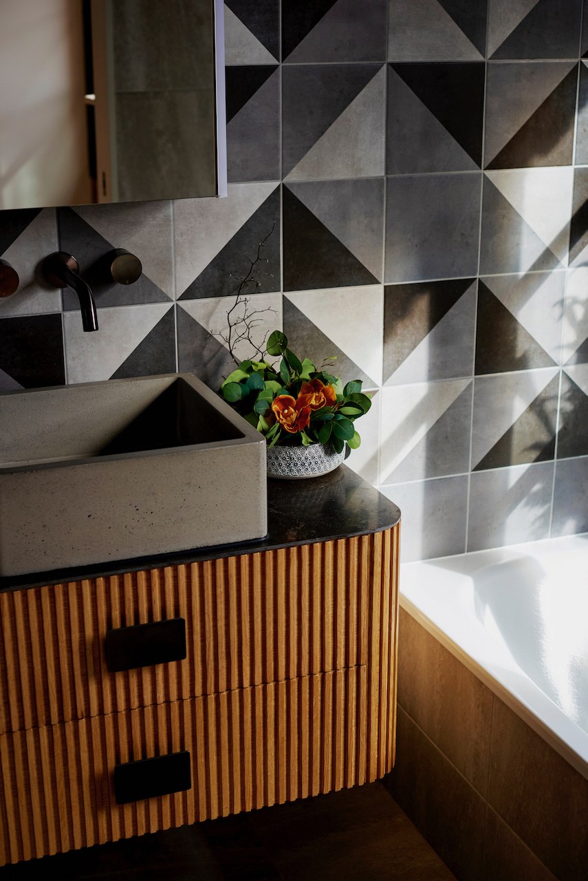 Lanes End powder room with concrete basin and geometric tile