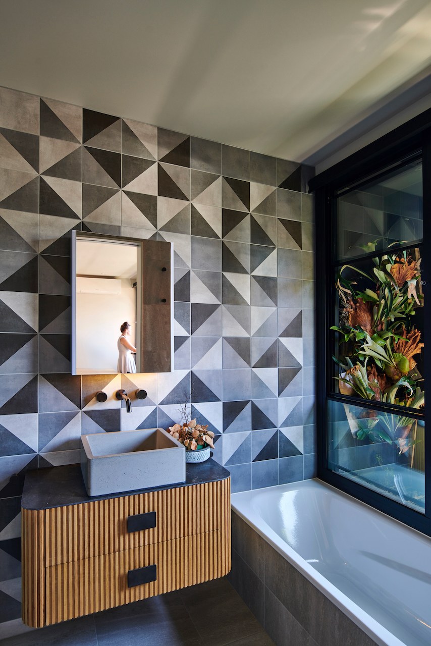 Lanes End powder room with geometric tile and window