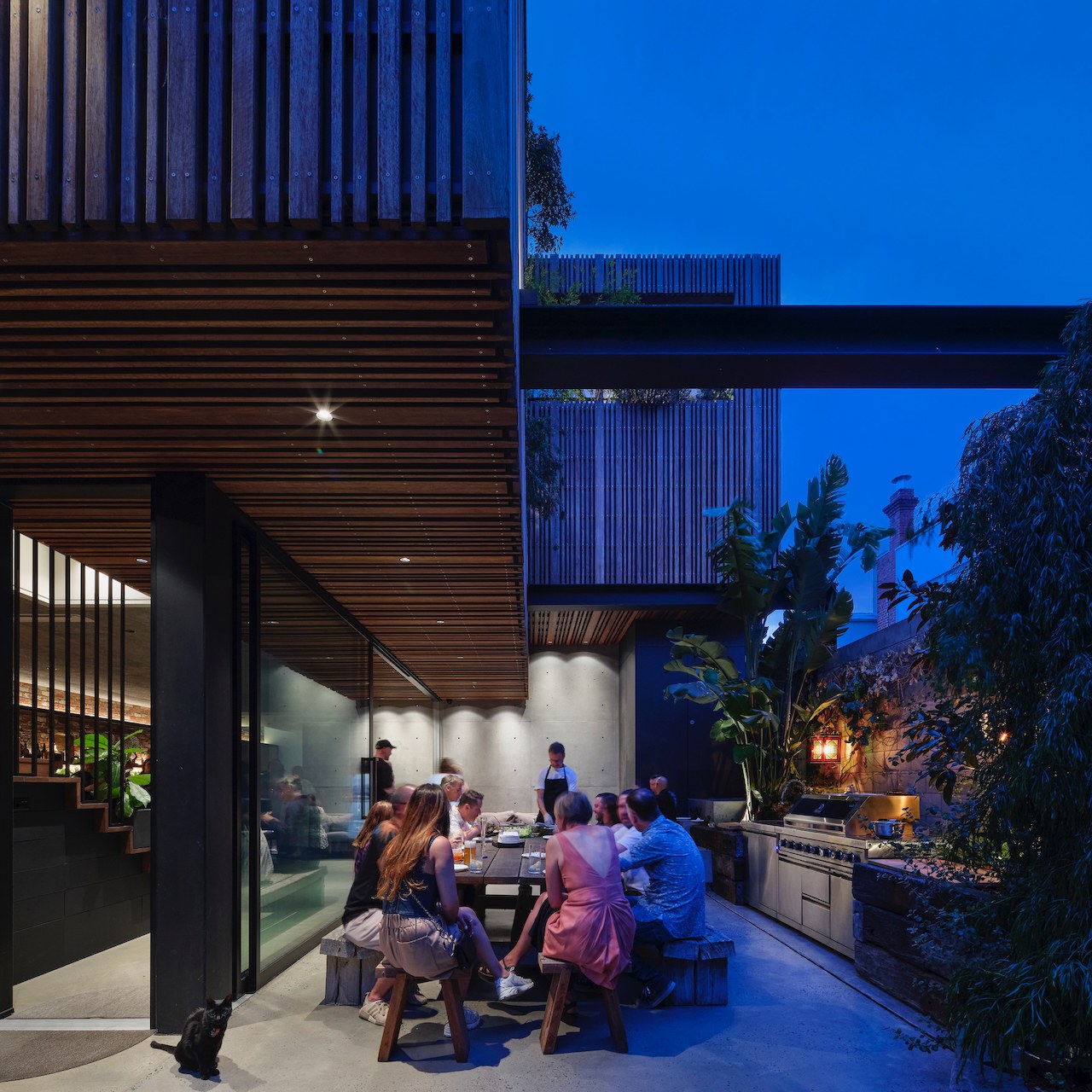 Lanes End courtyard gathering at dusk