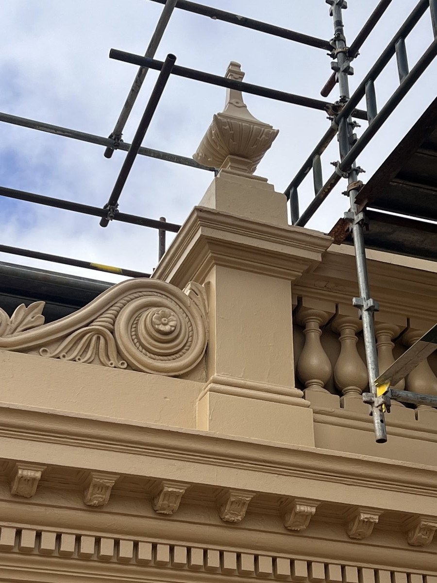 Old Colonist cornice detail with construction scaffolding