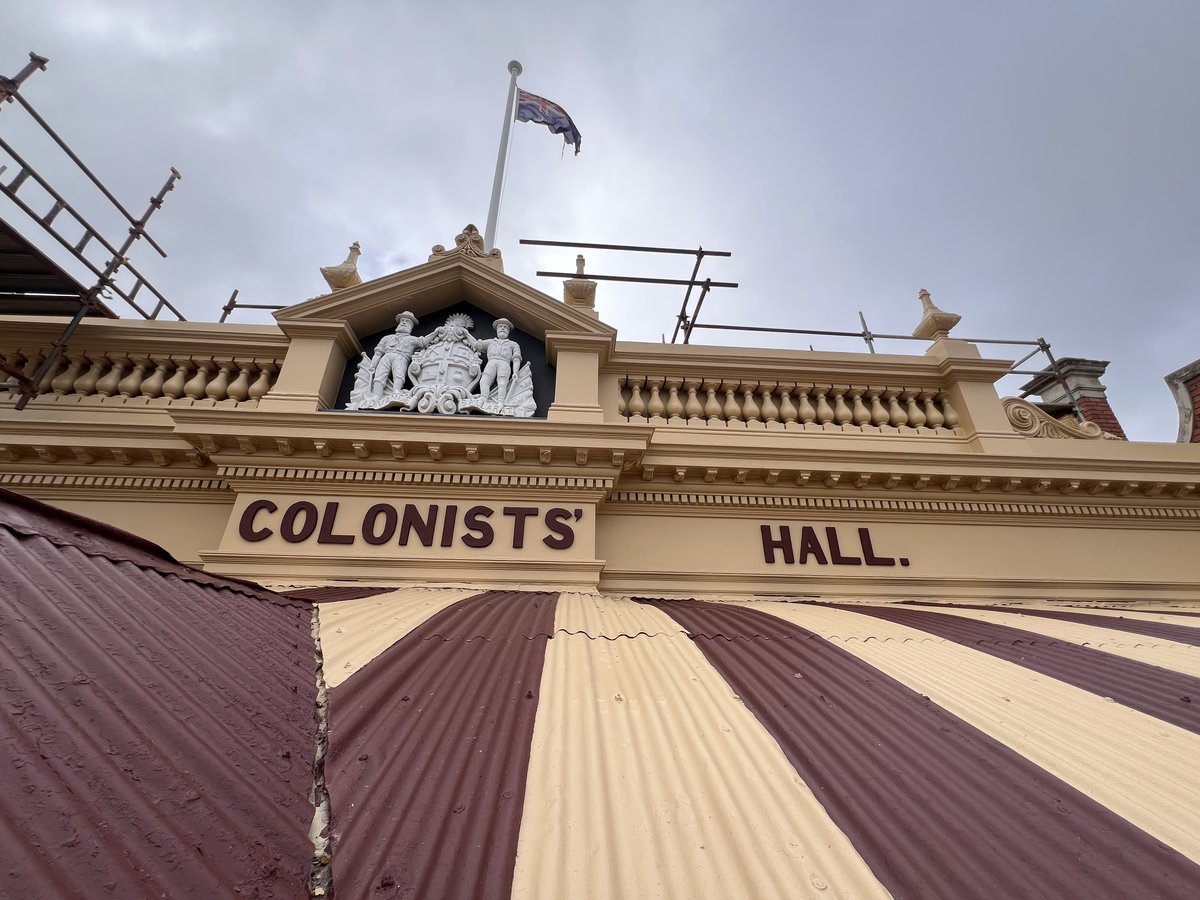 Old Colonist pediment and coat of arms relief